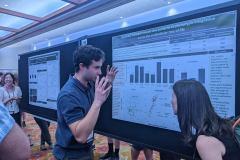 Jimmy presenting poster at Evolution 2023